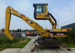 фото Caterpillar M322C-MH - перегружатель