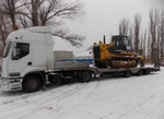 фото Перевозка техники бытовок вагончиков емкостей тралом