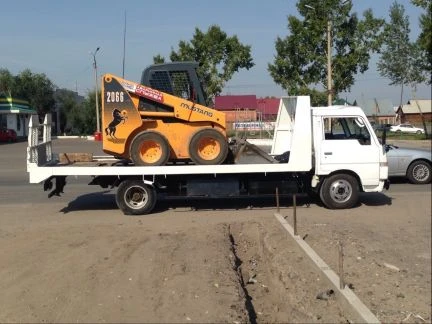 Фото Эвакуатор Эксковатор bobcat Гравий щебень песок