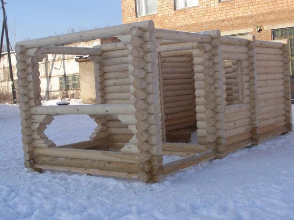 Фото Дома и срубы из оцилиндрованного бревна.