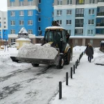 Услуги по уборке снега экскаватором-погрузчиком