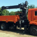 фото Бортовой КАМАЗ 65117 с тросовым КМУ HORYONG HRS 216