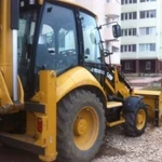 Услуги экскаватора погрузчикаCaterpillar