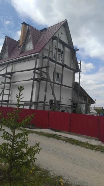 Фото Штукатурка фасада дома